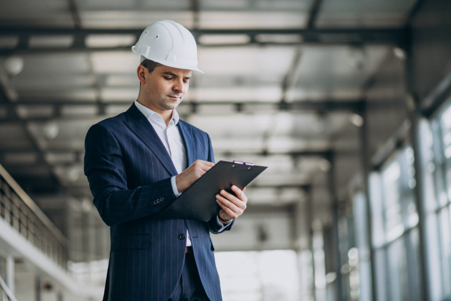 Construction manager in a suit and hard hat, highlighting high-paying blue-collar careers