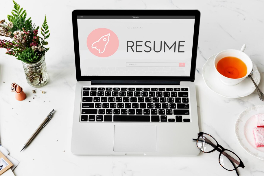 Laptop with digital resume template on screen